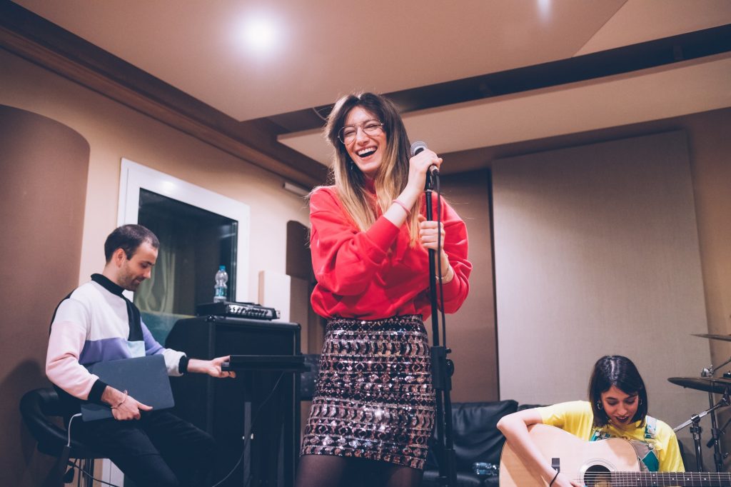 young woman singer rehearsing