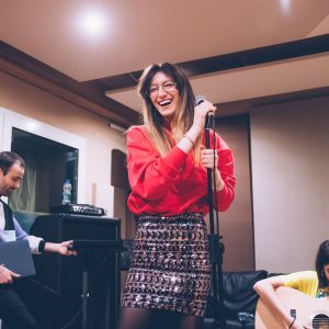 young woman singer rehearsing